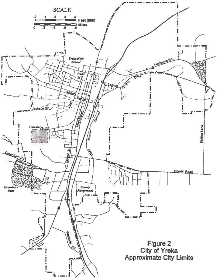 Map of the City of Yreka showing approximate city limits with a dashed boundary line. Major landmarks and streets are labeled including Yreka High School, Main Street, Oregon Street, Greenhorn Park, County Fairgrounds, Oberlin Road, Phillipe Lane, Montague Road, and Foothill Drive. The Yreka Western Railroad tracks are shown running through the eastern portion of the city.