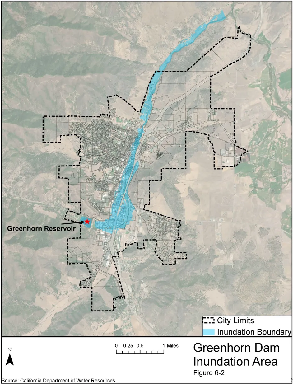 Aerial map of the City of Yreka showing the Greenhorn Dam inundation boundary. The inundation area, highlighted in light blue, extends from the Greenhorn Reservoir on the west side of the city northward along Yreka Creek through the center of the city and beyond the northern city limits. Source: California Department of Water Resources.